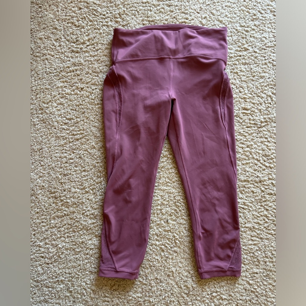 Lululemon, dark pink, size 12, 23” length, with beautiful side of leg details
